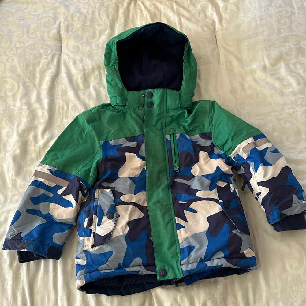 Boys camo print winter jacket with removable hood.